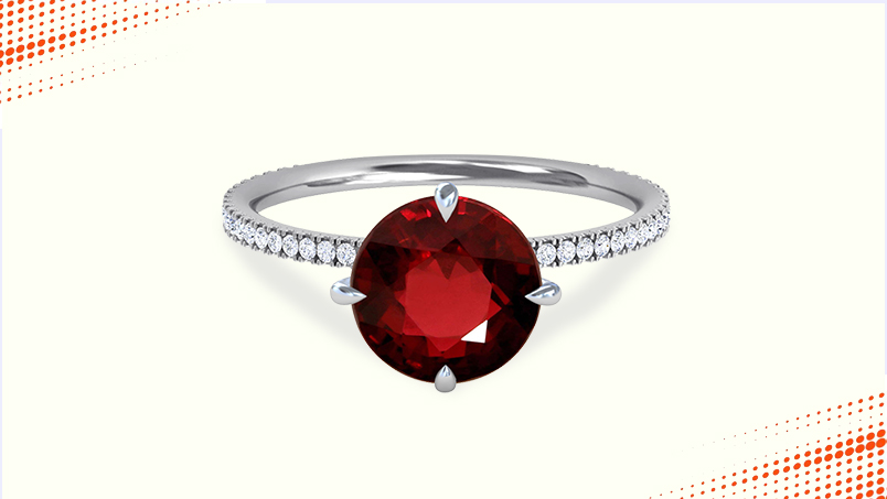 ruby round cut with prong set diamonds
