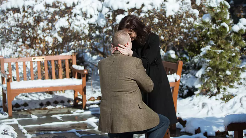 guy proposing his girlfriend in St Luke in the Fields Garden 
